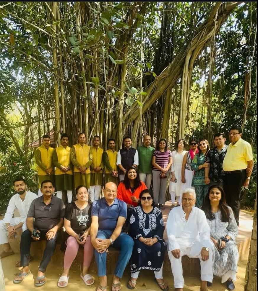 Group gathered under a banyan tree on a retreat